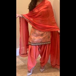 Beautiful orange 3 piece outfit.